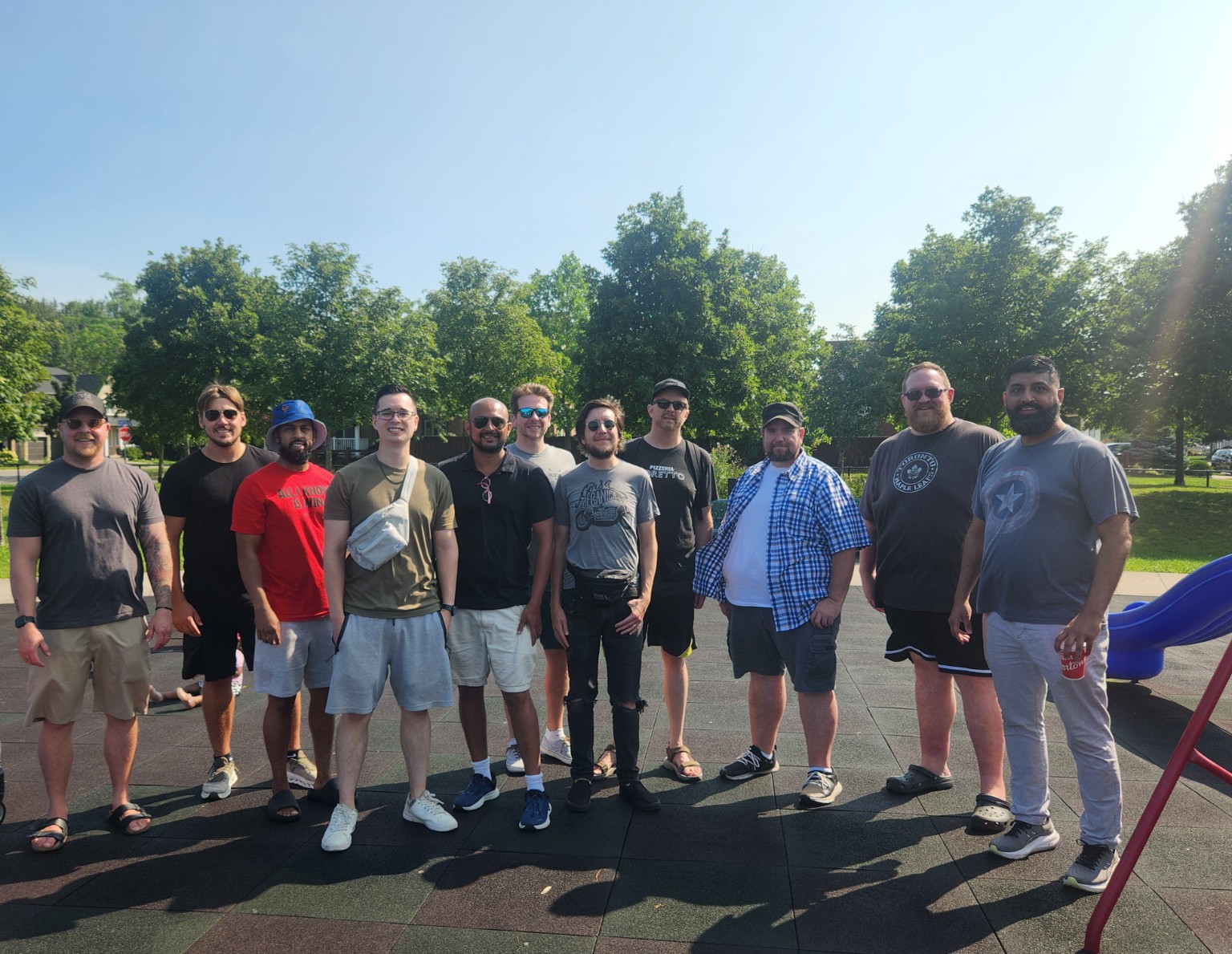 Group of dads standing together outdoors in Durham Region
